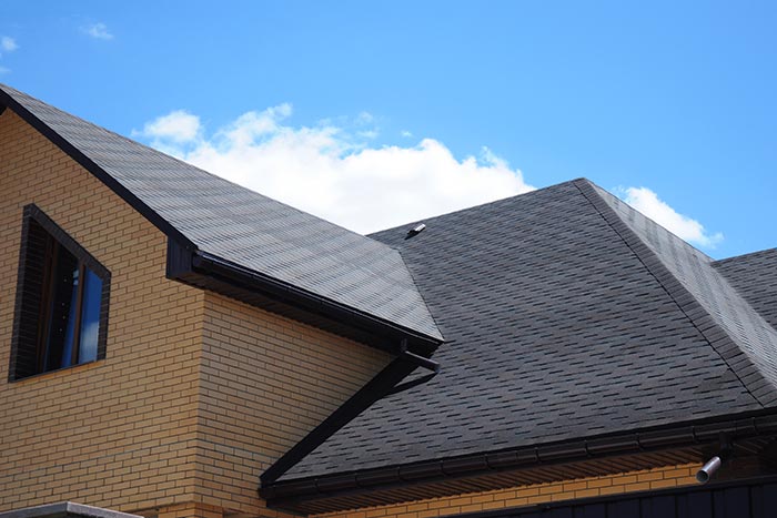 asphalt shingles on brick home